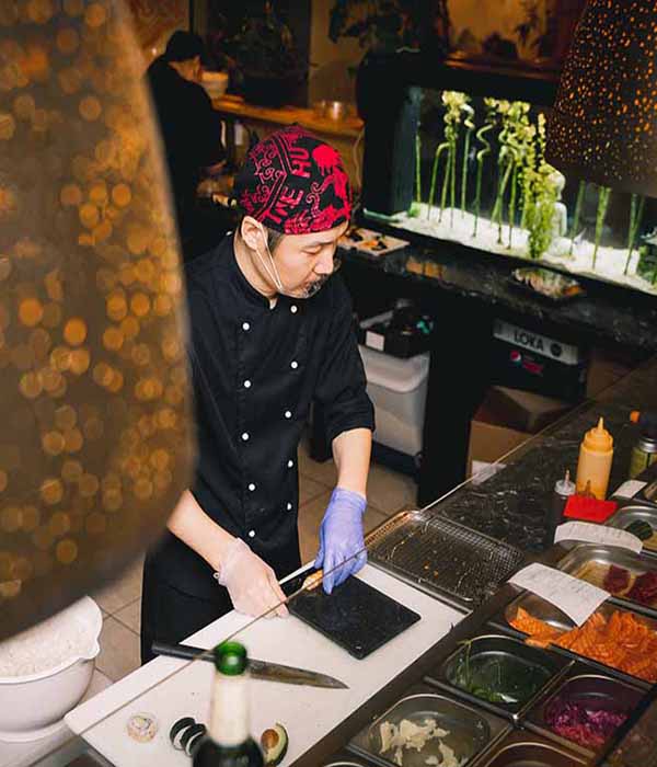 male chef making sushi